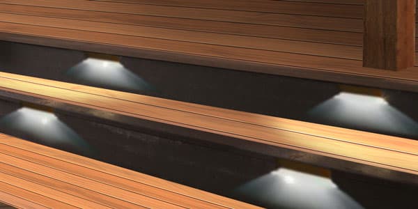 Composite deck with integrated step lighting